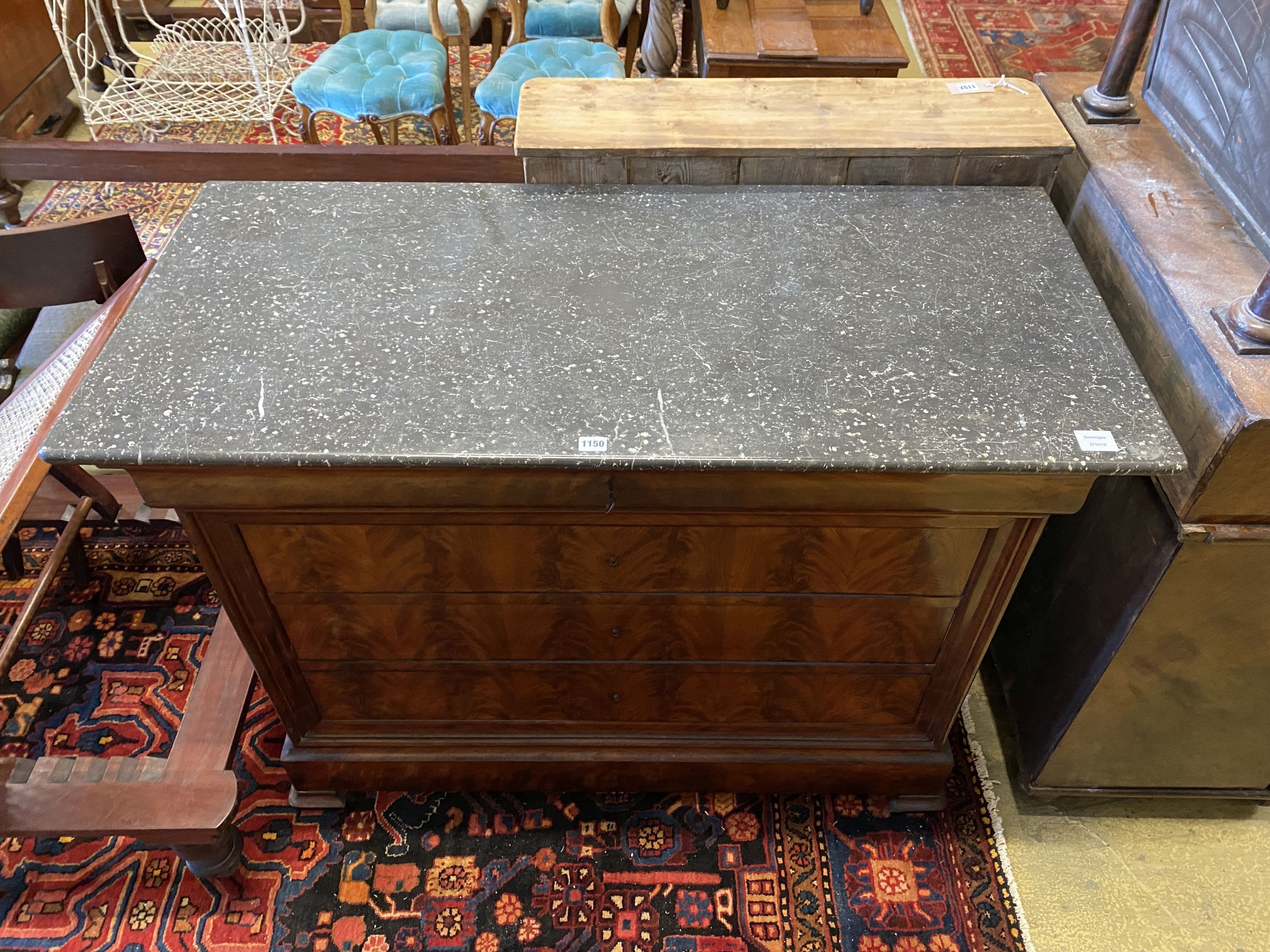 A 19th century continental flamed mahogany commode with black polished marble top, width 126cm, depth 58cm, height 95cm